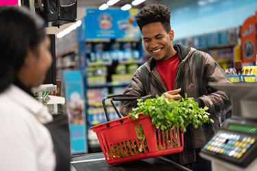 person checking out at grocery store